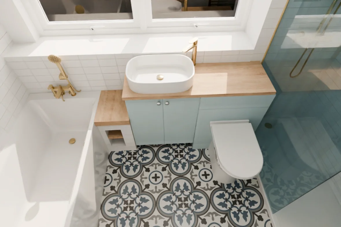 Completed bathroom with patterned floor tiles, blue vanity, bath and glass shower enclosure